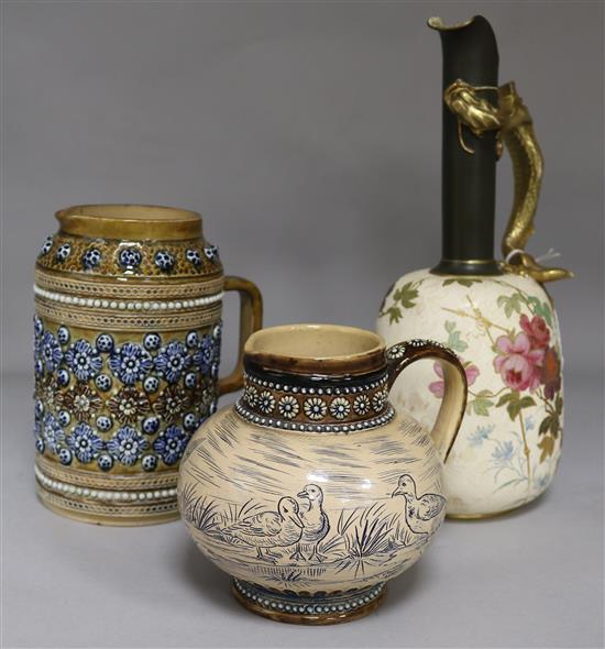 A Doulton Burslem dragon ewer, a Doulton Lambeth jug and a sgraffito jug